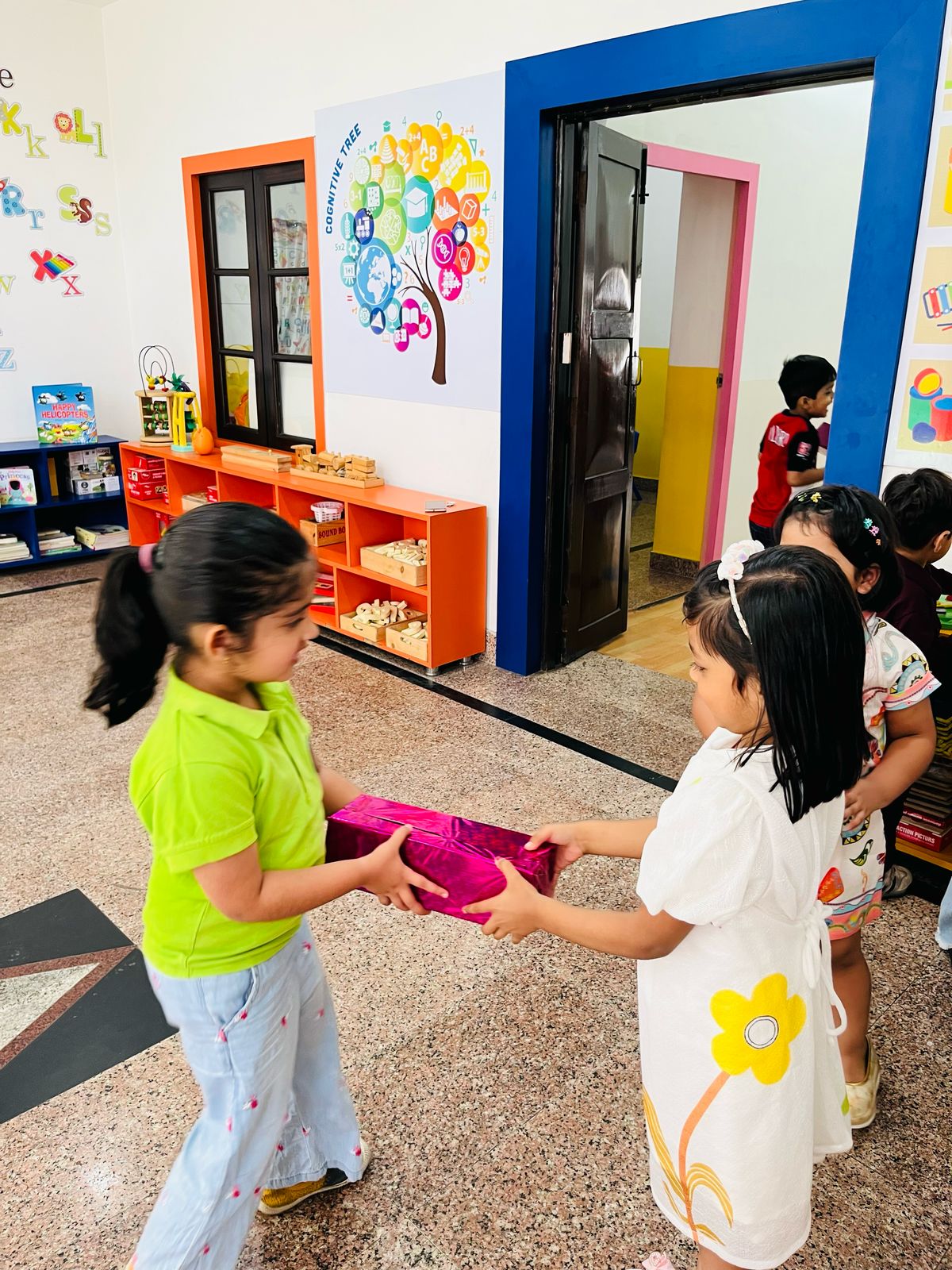 Group of children doing a colorful science experiment with their teacher
